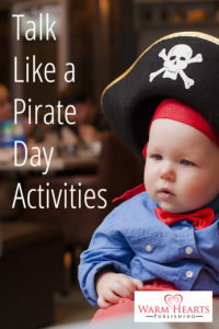 Baby wearing pirate hat - Talk Like a Pirate Day Activities